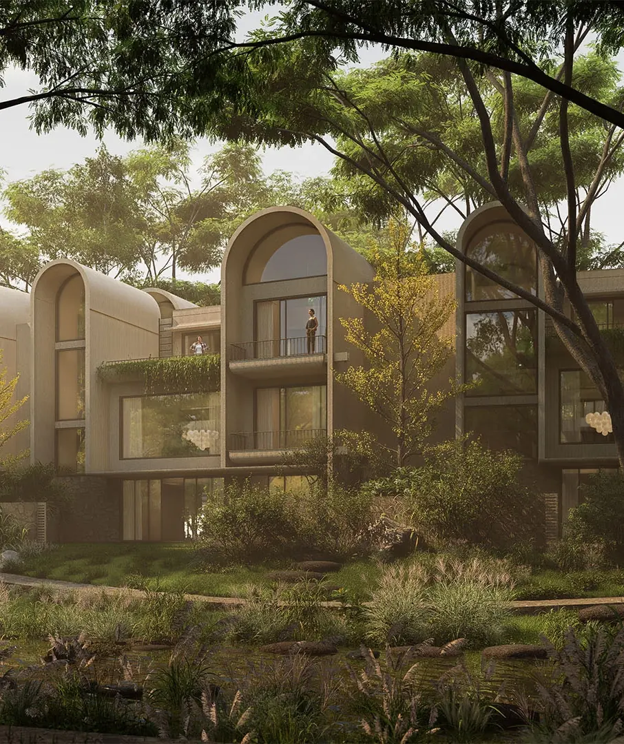 Villa Homes at Embassy Riverine among tall trees and a landscaped corridor